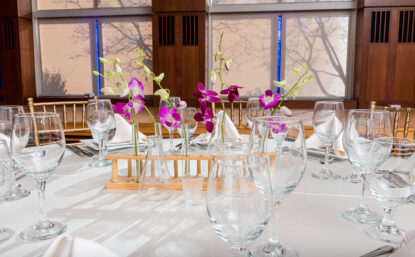 dining table with orchids and test tubes